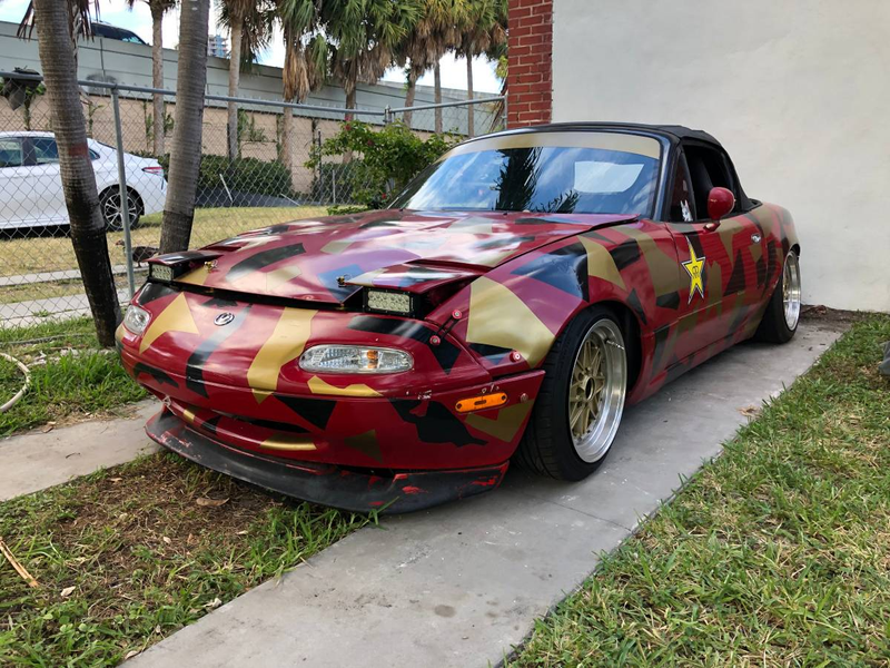 Illustration for article titled At $2,500, Is This Custom 1992 Mazda MX-5 Miata a Book You Don’t Judge by its Cover?